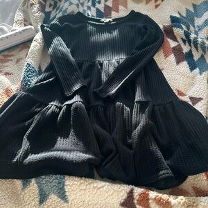 Black long sleeve dress with flow like skirt